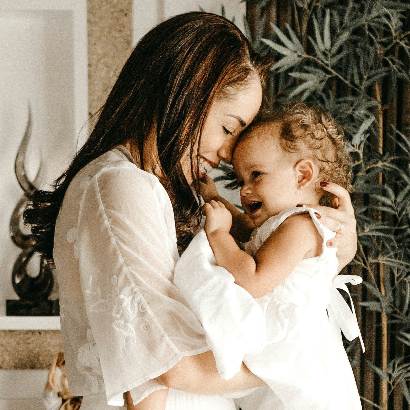 A mother and baby snuggling with each other